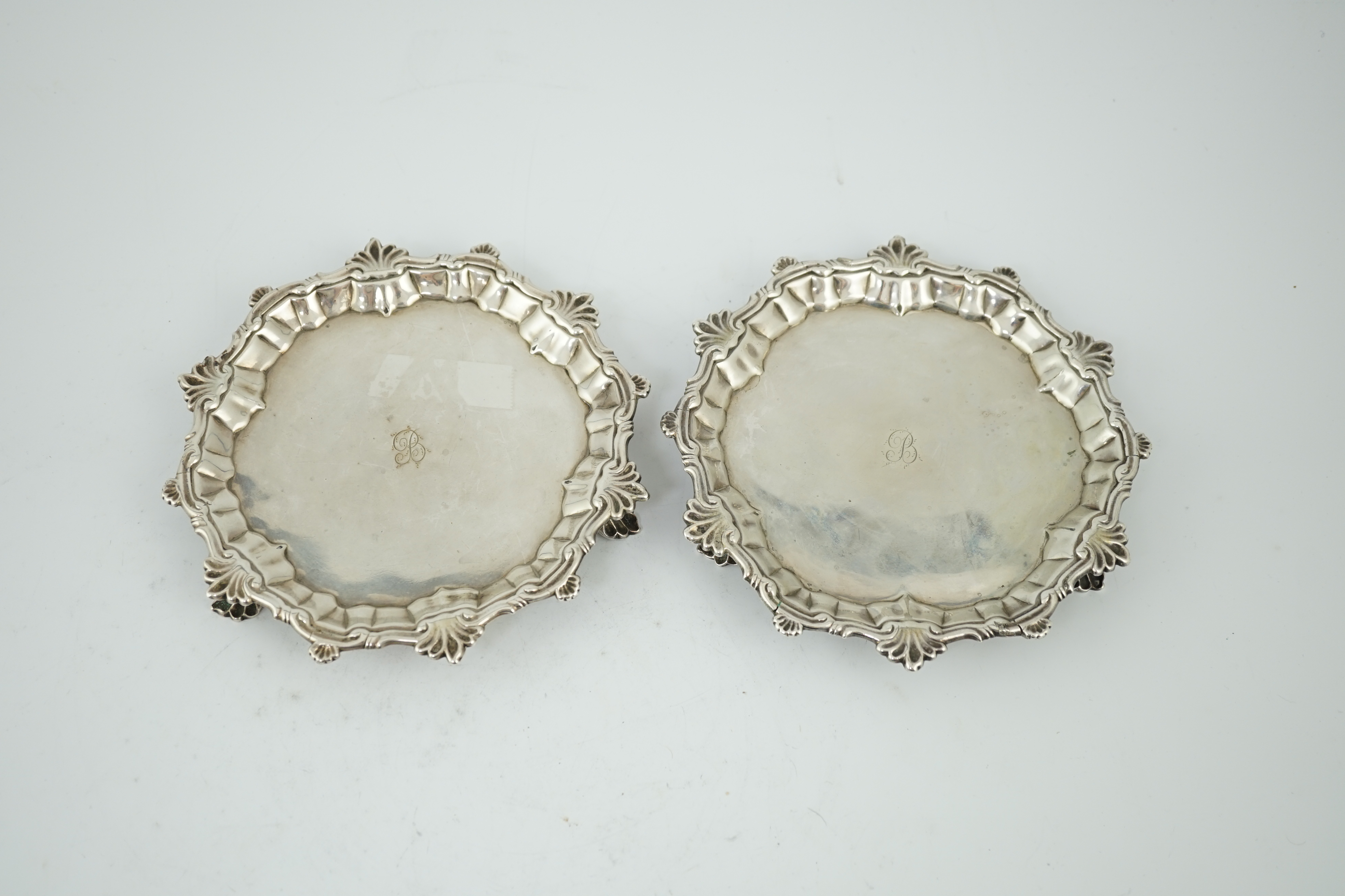 A pair of George II silver waiters, by William Peaston